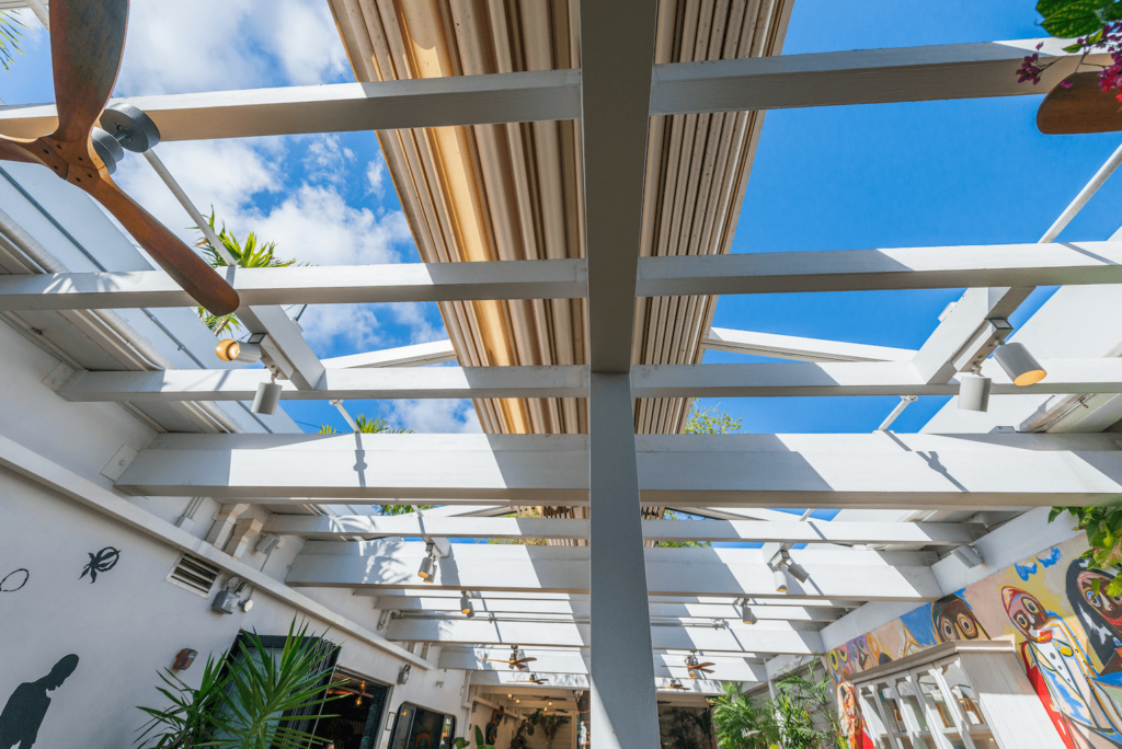 Retractable fabric pergola system