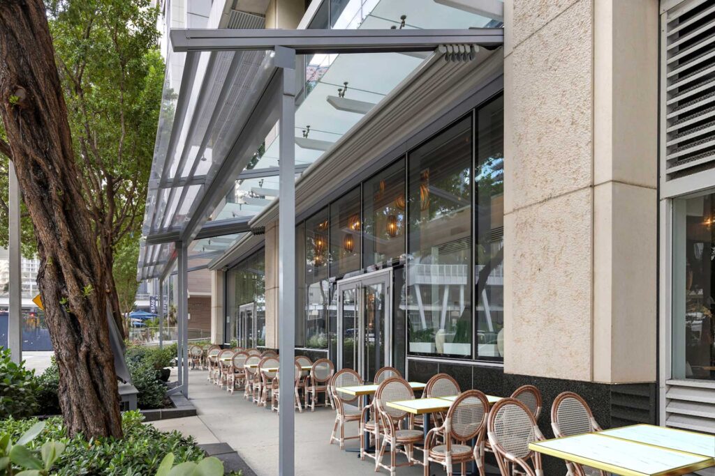 retractable pergola system over restaurant dining terrace