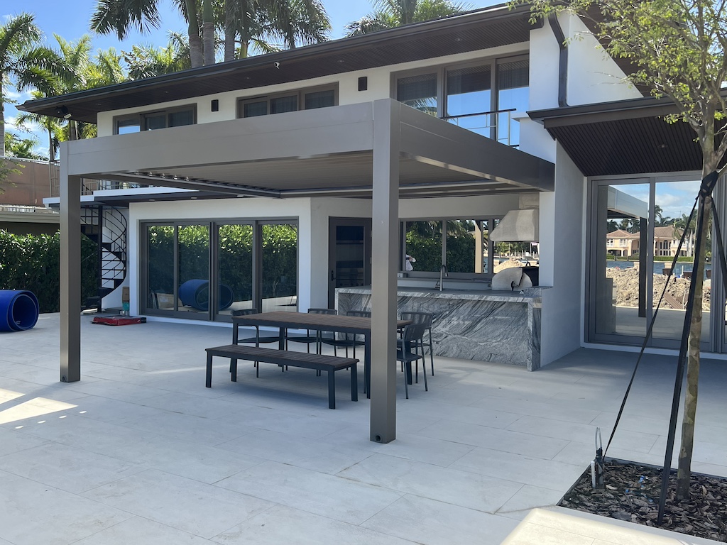 Louvered pergola with waterproof roof