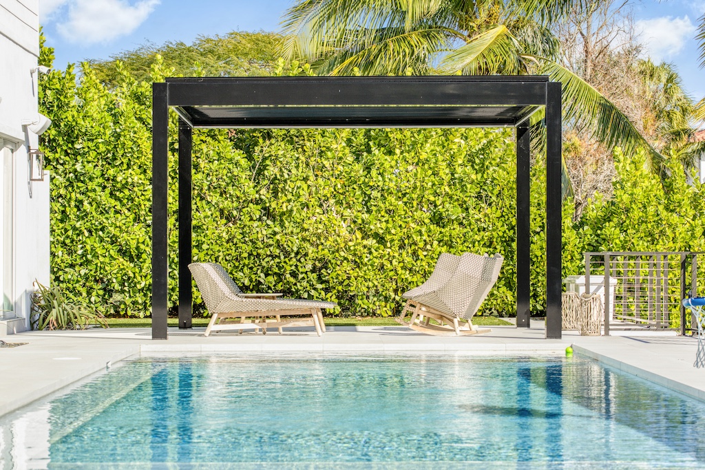 Modern pergola installed beside a swimming pool