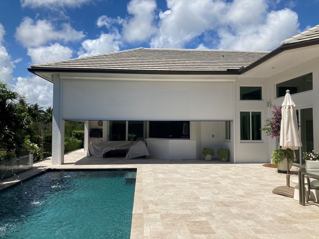 Hurricane screens shielding a South Florida home from strong winds