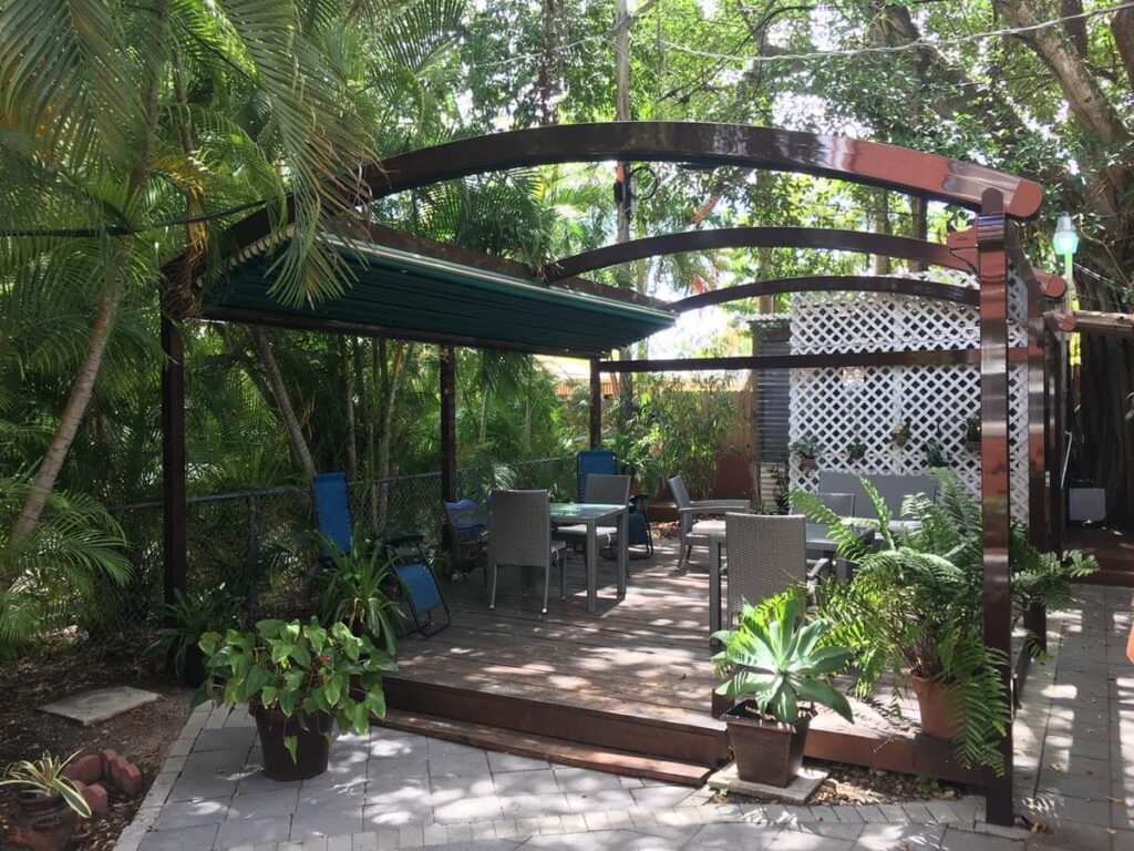 elegant pergola featuring cozy seating, greenery, and decorative accents elegant pergola featuring cozy seating, greenery, and decorative accents