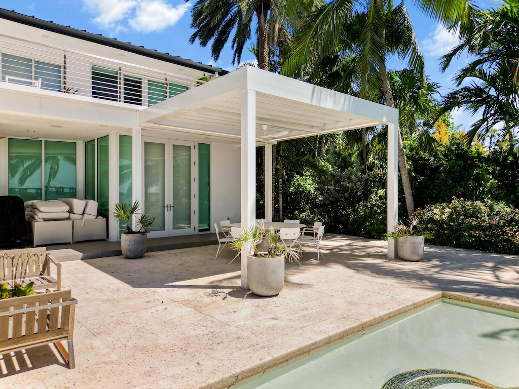 Designer pergola extending a deck to create a connected outdoor living space