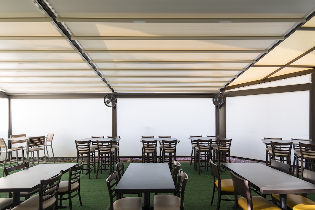Hurricane screens protecting a business from severe weather