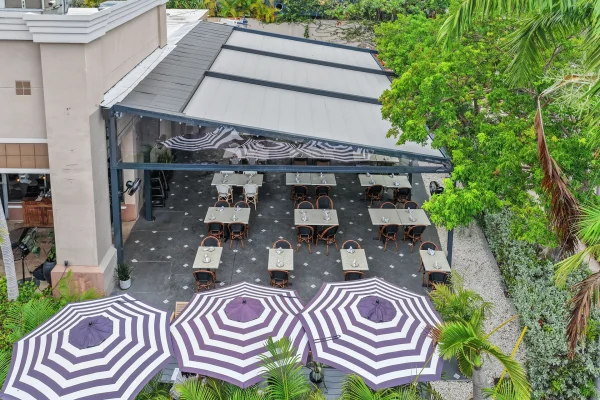 retractable fabric pergola over outdoor dining terrace
