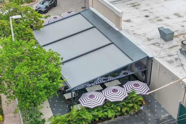retractable fabric pergola over outdoor dining terrace