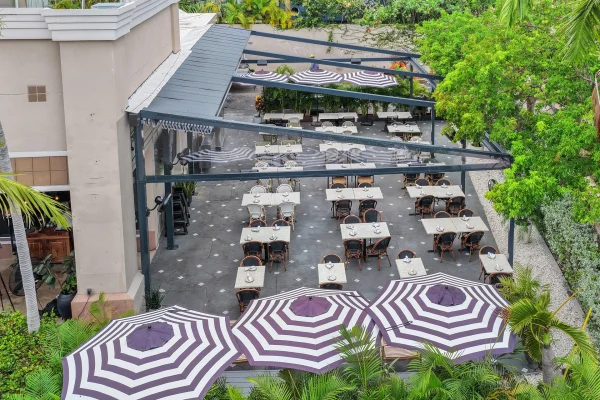 retractable fabric pergola over outdoor dining terrace