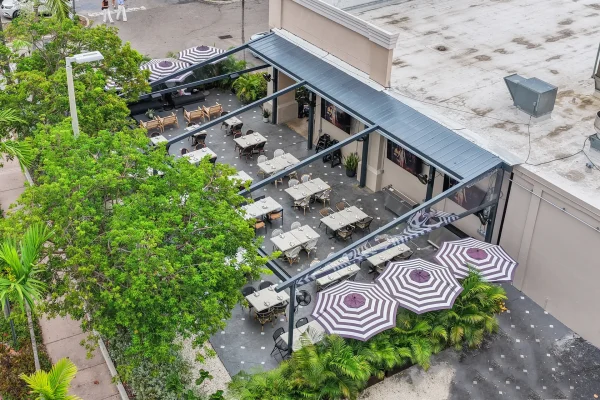 retractable fabric pergola over outdoor dining terrace
