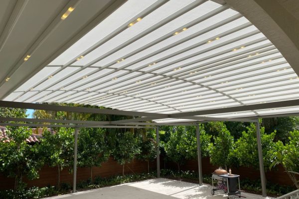 white fabric retractable canopy over outdoor terrace