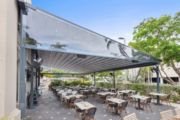retractable fabric pergola over outdoor dining terrace
