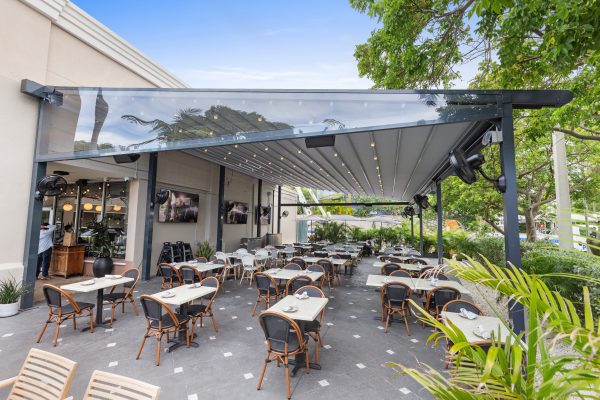 retractable fabric pergola over outdoor dining terrace