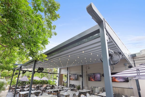 retractable fabric pergola over outdoor dining terrace