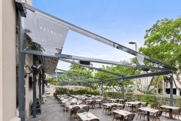 retractable fabric pergola over outdoor dining terrace